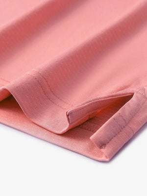 Detail of side slit hem on PEACH PINK 4 Way Stretch Jacquard Polo — clean stitching and stretch finish
