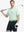 Model wearing Modern Texture Stylish Polo in MINT GREEN, front half-body view holding golf club.