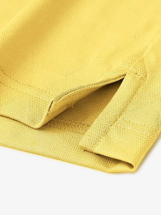 Close-up detail of hem opening on Modern Texture Stylish Polo in YELLOW.