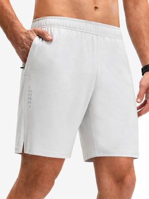 Front lower body shot of model wearing white breathable running shorts with 4 zipper pockets
