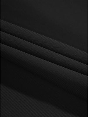 Close-up texture of black women's regular fit stretchy golf pants fabric showing detailed stretchy material and weave.