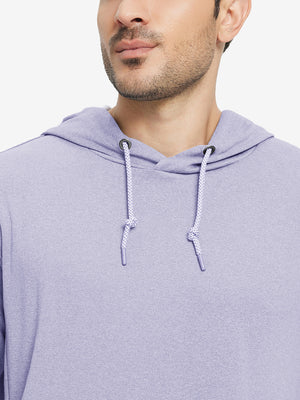 Close-up from nose to chest, showing soft heather texture and collar detail of the light purple melange hoodie.