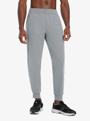 Front lower body view of model wearing LIGHT GREY Performance Tapered Sports Joggers