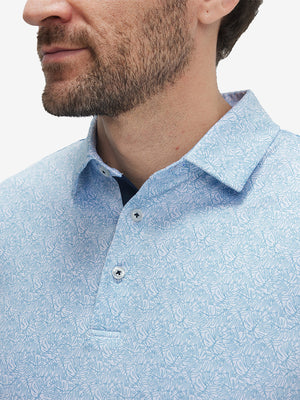 Front view from nose to chest of model wearing the light blue line leaf 4 way stretch print collared polo shirt, showcasing the upper fit