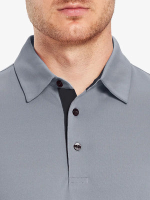 Model wearing the light grey long sleeve pique polo, showcasing its casual and comfortable design.