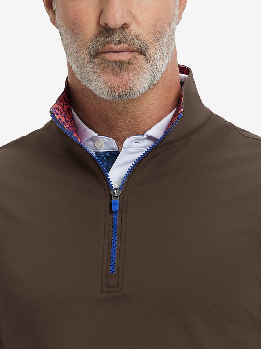 Close-up from nose to chest, showing collar detail and zipper of the coffee brown golf vest.