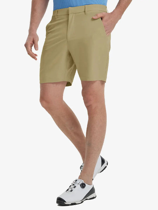Front view of model’s lower body with hands in pockets, wearing Player Fit Versatile Solid Shorts 7 Inch – KHAKI