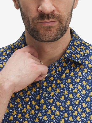 Front view from nose to chest of model wearing the yellow duck 4 way stretch print collared polo shirt, showcasing the upper fit