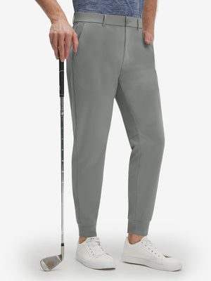 Front lower body shot of model wearing iron grey flat front golf joggers pants with belt loops
