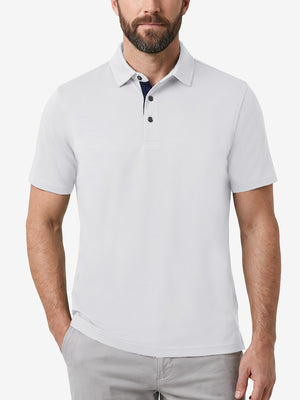 Front upper body shot of model wearing white  ultra-comfort slim fit roma knit polo shirts