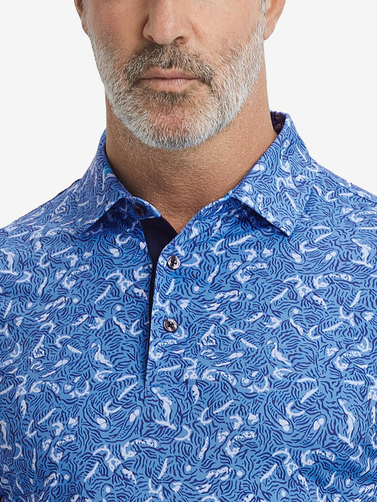 Close-up from nose to chest, showing collar and fabric pattern detail of the line animal polo shirt.