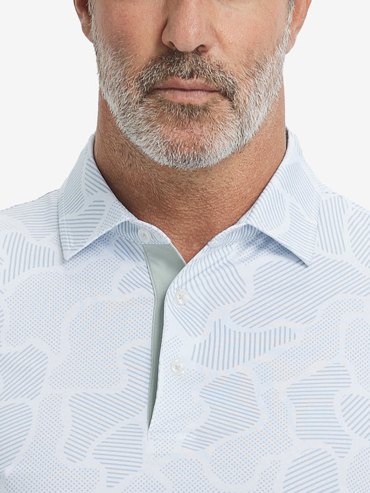 Close-up from nose to chest, showing collar and fabric pattern detail of the light gray irregular pattern polo shirt.