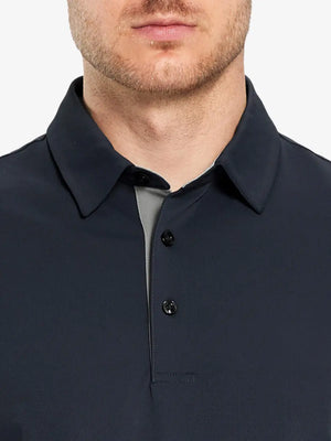 Model showcasing the dark grey long sleeve pique polo, highlighting its modern and sleek design.