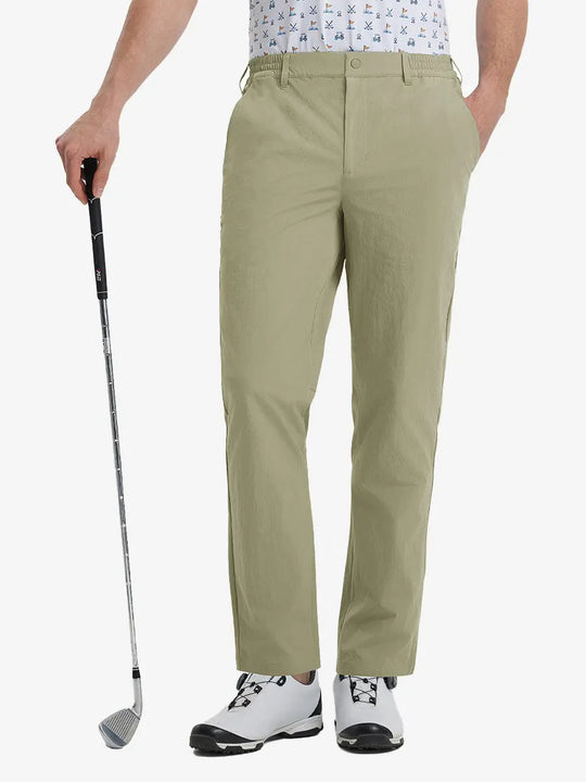 Front lower leg view of Performance Water Resistant Pants in KHAKI，model holds golf club in right hand.