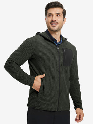 Model with one hand in pocket wearing full zip fleece hoodied jacket in forest green, relaxed look.