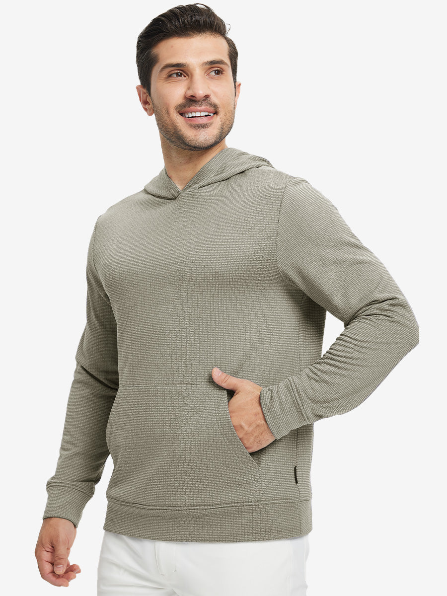 Model front view with one hand in side pocket wearing warm fleece golf hoodies pullover  dust beige.