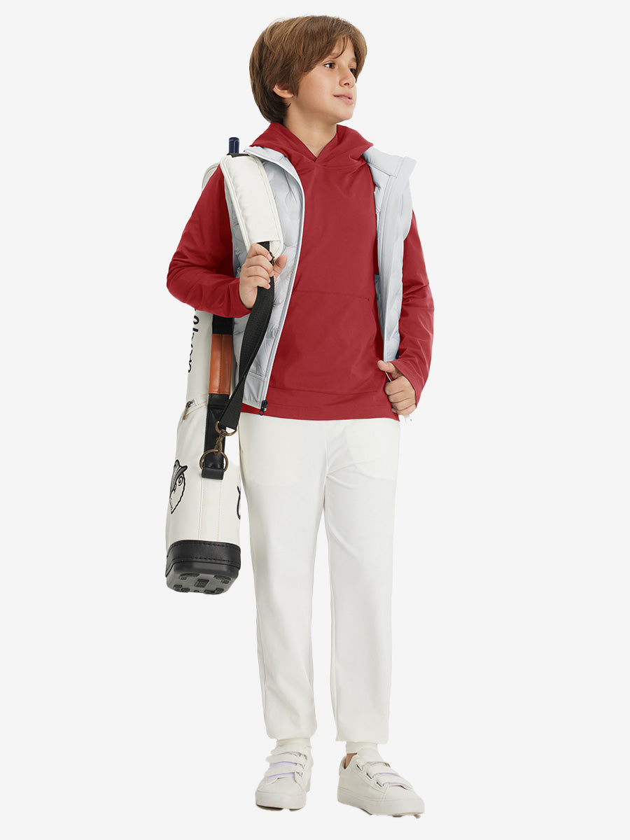 Model carrying golf bag, dressed in youth long sleeve hoodied with kangaroo pocket in red, full-body.
