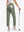 Back lower-body view holding a golf ball with glove in rear pocket wearing OLIVE GREEN Women's 7/8 Ankle Golf Track Pants.