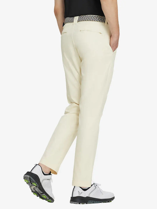 BEIGE Water Resistant Everyday Pants back view, model's lower body with both hands in pockets