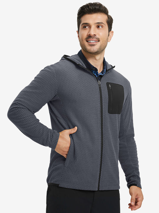 Model with one hand in pocket wearing full zip fleece hoodied jacket in grey, relaxed look.