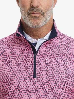 Close-up from nose to chest, showing zipper collar detail and fabric pattern of the red navy flower pullover.