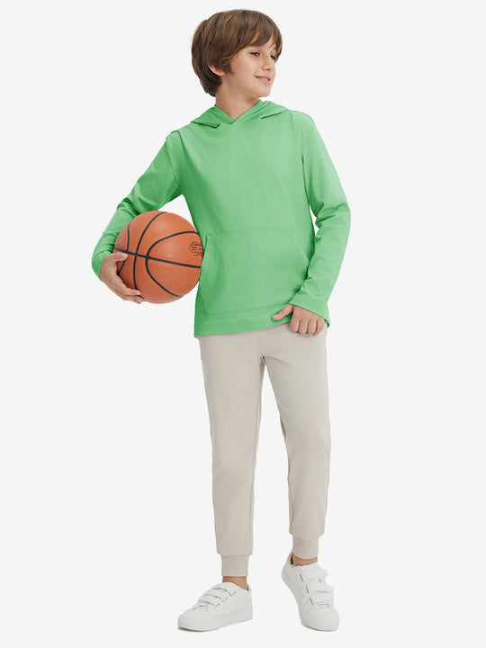 Full-body view of model holding basketball, wearing youth long sleeve hoodied with kangaroo pocket in light green.