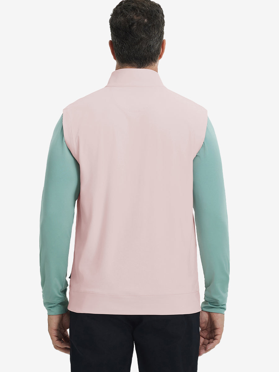 Back upper body view of the light pink print collar quarter zip golf vest, clean cut and relaxed posture.