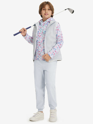 Full-body shot of model wearing misty grey fleece stretch water resistant boys joggers while holding a golf club.