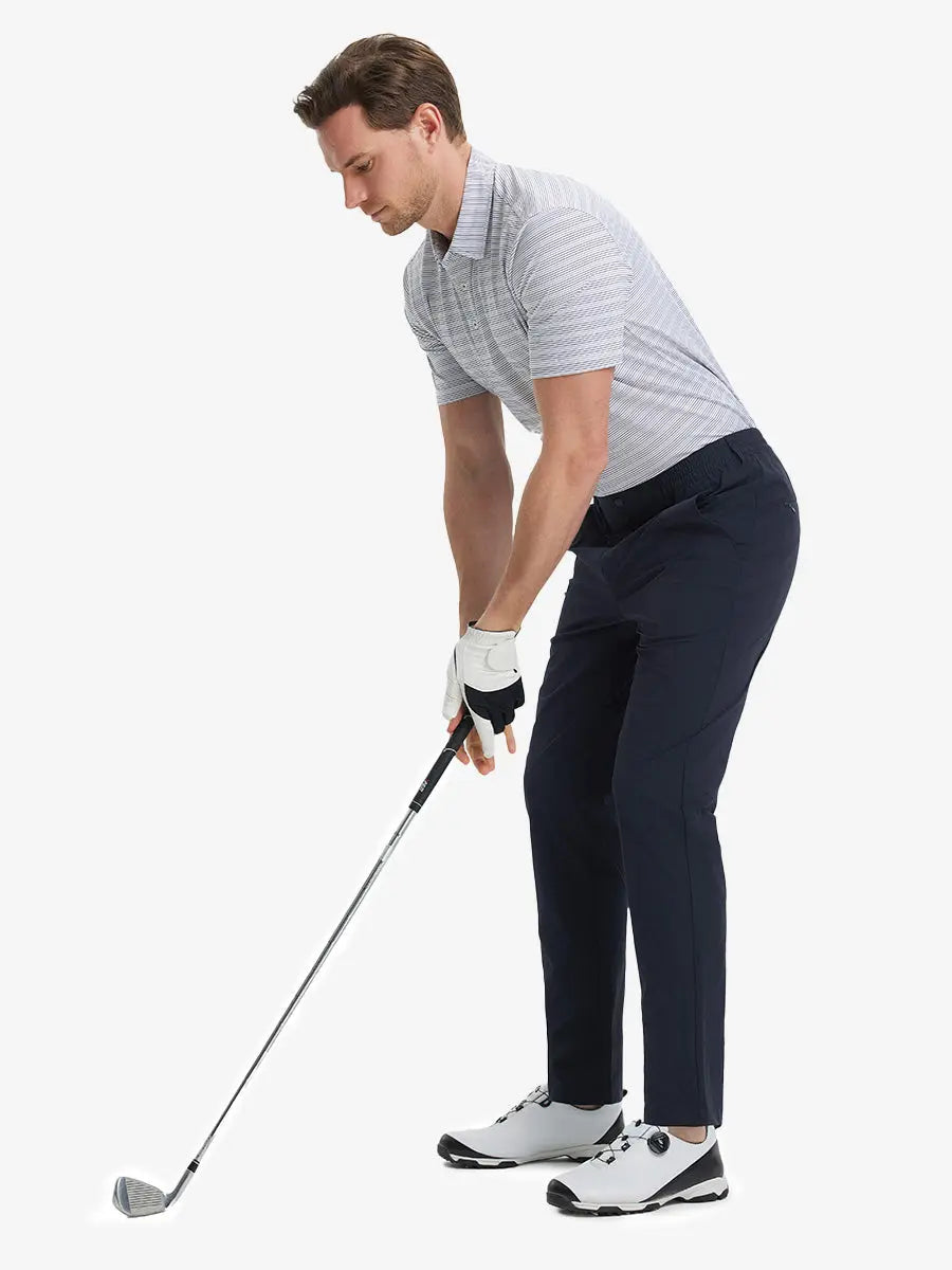 Full front view of model in Performance Water Resistant Pants NAVY，ready for golf with club in hand.