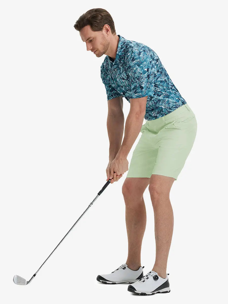 Full-body front shot of model holding golf club, wearing Player Fit Versatile Solid Shorts 9 Inch – LIGHT GREEN