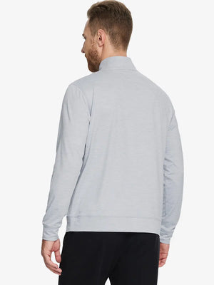 Back half-body view of model in FADED DENIM HEATHER Quarter Zip Melange Pullover highlighting smooth fit.