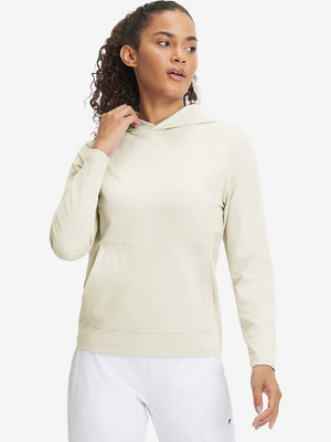Model holding hoodie cap with both hands, wearing women's lightweight hoodies pullover in cream.