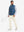 Model holding a tennis racket, wearing khaki light soft lightweight casual golf pants with 5 pockets.