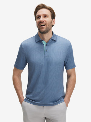 Male model front upper body wearing Performance quick dry print golf polos, sleek navy light blue ovals look