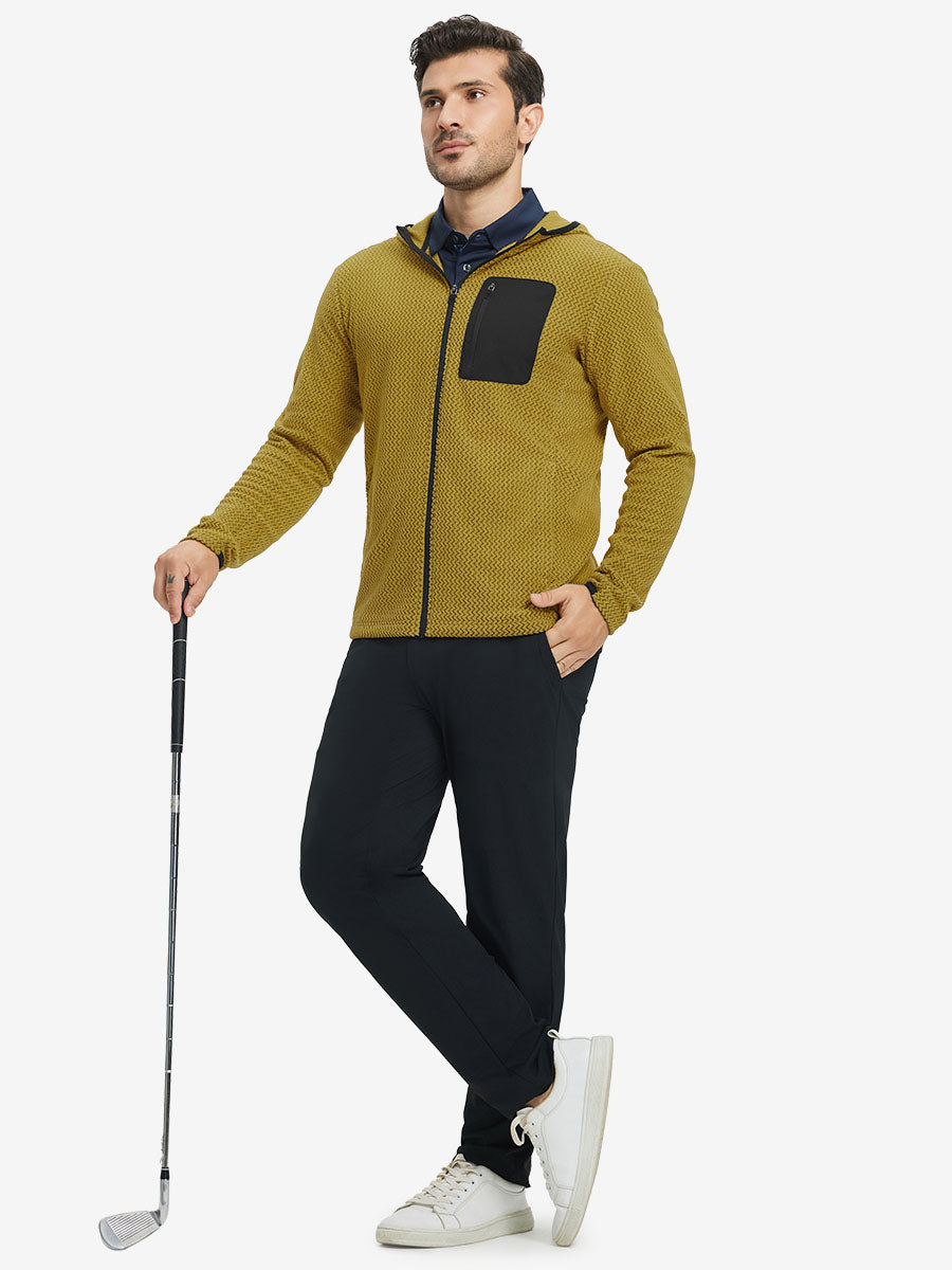 Model holding golf club, dressed in full zip fleece hoodied jacket in yellow, sporty and casual.