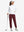 Full-body front view of model wearing women's stretch fleece lined water resistant joggers in wine.