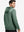 Back upper body view of the dark green melange classic heather hoodie, model turns head slightly with ease.