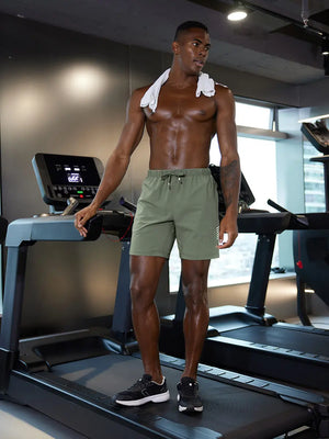 Full-body gym view of model in OLIVE GREEN 2 in 1 Running Sports Shorts with Liner