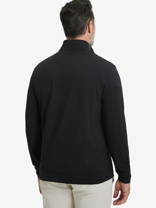 Back upper body view of the black lightweight golf pullover, model turns head slightly with ease.