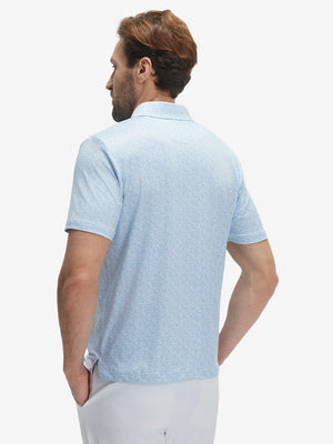 Back half-body view of model wearing the light blue line leaf 4 way stretch print collared polo shirt, highlighting the rear silhouette