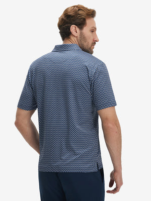 Back upper body view of model in Performance quick dry print golf polos with subtle blue white stars tone