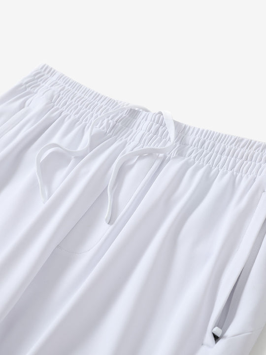 Angled view of lightweight women's stretchy joggers sweatpants waistband displayed in white.