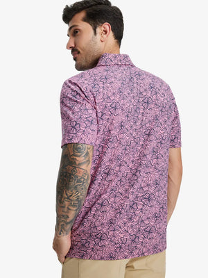 Back half-body view of model in MAUVE FLOWER Popular Heather Print Polo