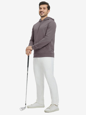 Model full-body view holding a golf club wearing warm fleece golf hoodies pullover indark red.