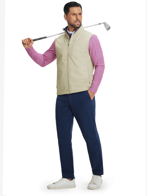 Full-body shot of model holding golf club while wearing sleeveless softshell fleece outdoor vests with 6 pockets in light khaki