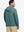 Back upper view of model wearing casual solid fleece hoodies pullover in ocean green, showing smooth seams.