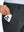 Side pocket detail of Golf Lightweight Fleece Lined Dress Pants in dark grey, holding smartphone