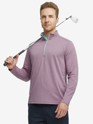Full-body shot of model holding a golf club in dusty rose melange moisture wicking quarter zip pullover