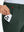 Side pocket detail of Golf Lightweight Fleece Lined Dress Pants in forest green, holding smartphone