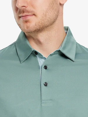 Male model wearing the Beryl Green Everyday Classic Solid Polo, front view from nose to chest